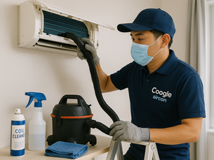 Coogle Aircon technician servicing a wall-mounted aircon unit in a Singapore HDB flat