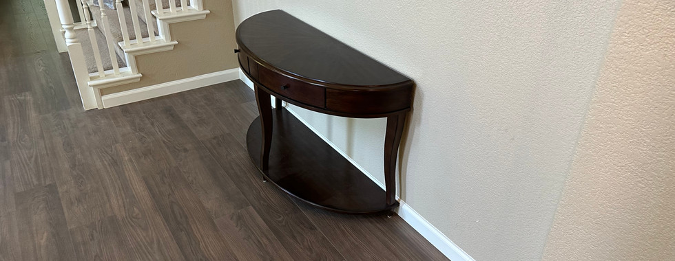 Living room featuring Mohawk dark laminate flooring, emphasizing its scratch-resistant and easy-to-clean properties