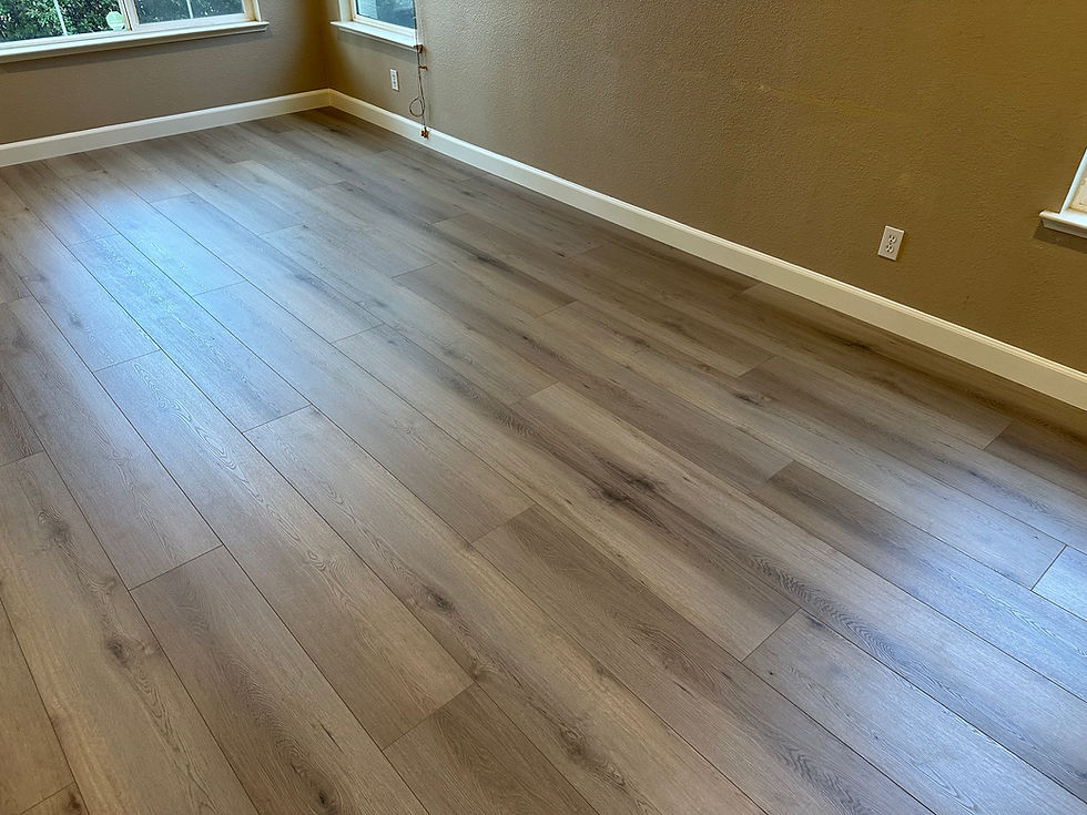 Close-up of 12mm laminate flooring installed in a Sacramento living room
