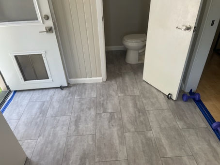 Vinyl Tile Installation and Baseboard Fitting 150 sq ft