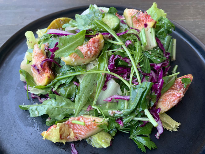 Colorful garden salad with figs