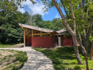 An educational pavilion with a path leading to it