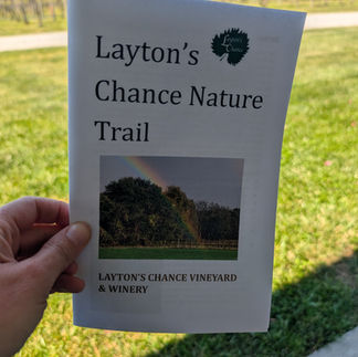 a hand holding a paper that says "laytons chance nature trail"