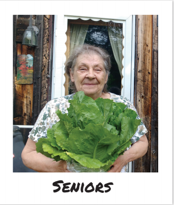 A customer of the FarmShare for Homebound Seniors holds a massive cabbage from Wyman's Farm in Milo, Maine