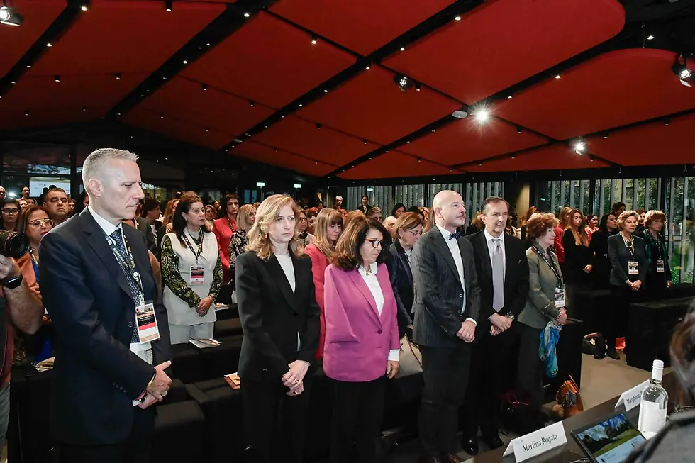 Women leaders in Italy attending a conference event.