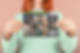 horizontal-post-card-mockup-being-held-by-a-woman-a20559.png