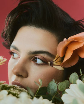 short hair model with flower accents on face and in hair