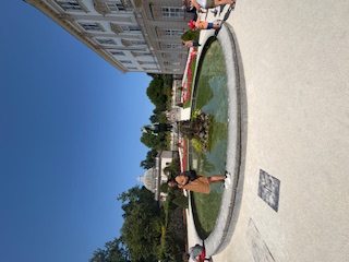 Woman standing on fountain where Sound of Music was shot