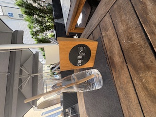 Table with a glass of water sitting on it