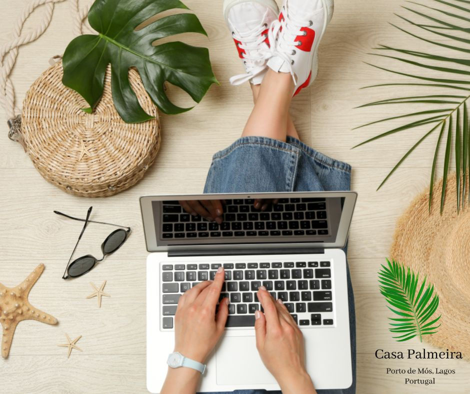 Planning your Algarve trip on a laptop, sharing travel tips and experiences from Casa Palmeira in Lagos, Portugal