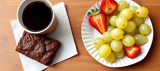 on a table top with an artificial walnut veneer rests a spread of refreshments from a chur