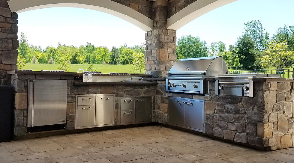 Covered Outdoor Kitchen with Stone Masonry and Stamped Concrete Floor