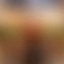 A couple walks hand-in-hand on a snowy Chicago Riverwalk path, surrounded by leafless trees and buildings. They appear happy and relaxed. Chicagoland Wedding Photographer, Chicagoland Proposal Photographer, Chicagoland Engagement Photographer, Geneva Wedding Photographer, Chicago Riverwalk engagement session, snowy chicago engagement session, winter chicago engagement session