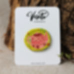 Handcrafted ceramic brooch with a charming teapot design on a lime green background, made by Veseto Ceramics