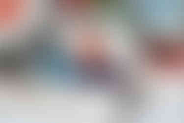 Ceramic envelope on a desk with a handwritten note - minimal natural scene.