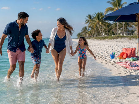 Family walking on calm Florida beach at sunset