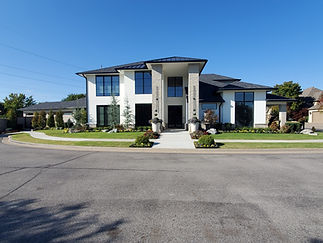 Completed 8,000 sf modern style home with manicured landscaping.jpg