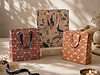 Three patterned gift bags with ribbon handles