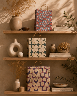 Patterned gift bags on wooden shelves with home decor