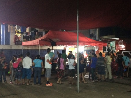 Displaced people queuing in a shelter in Escuintla, Guatemala, after the Volcán Fuego eruption in 2018