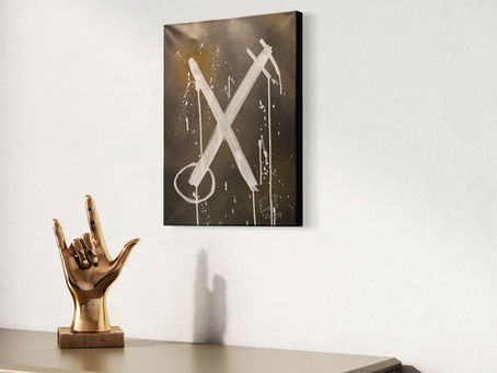 abstract painting white x with black and gold background hung on call