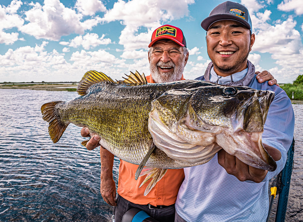 Florida Big Fish Adventures clients with a giant bass
