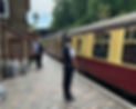 Platform staff preparing to dispatch a train