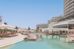 AVA Resort Cancun pool and loungers.