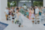 Groom dipping bride for a kiss after wedding ceremony at Fountain Gazebo venue at Dreams Onyx resort.