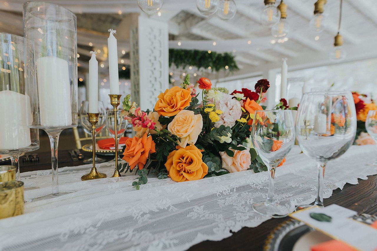 Coral floral centerpiece for wedding reception.