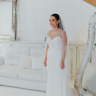 Beautiful bride in elegant white dress.