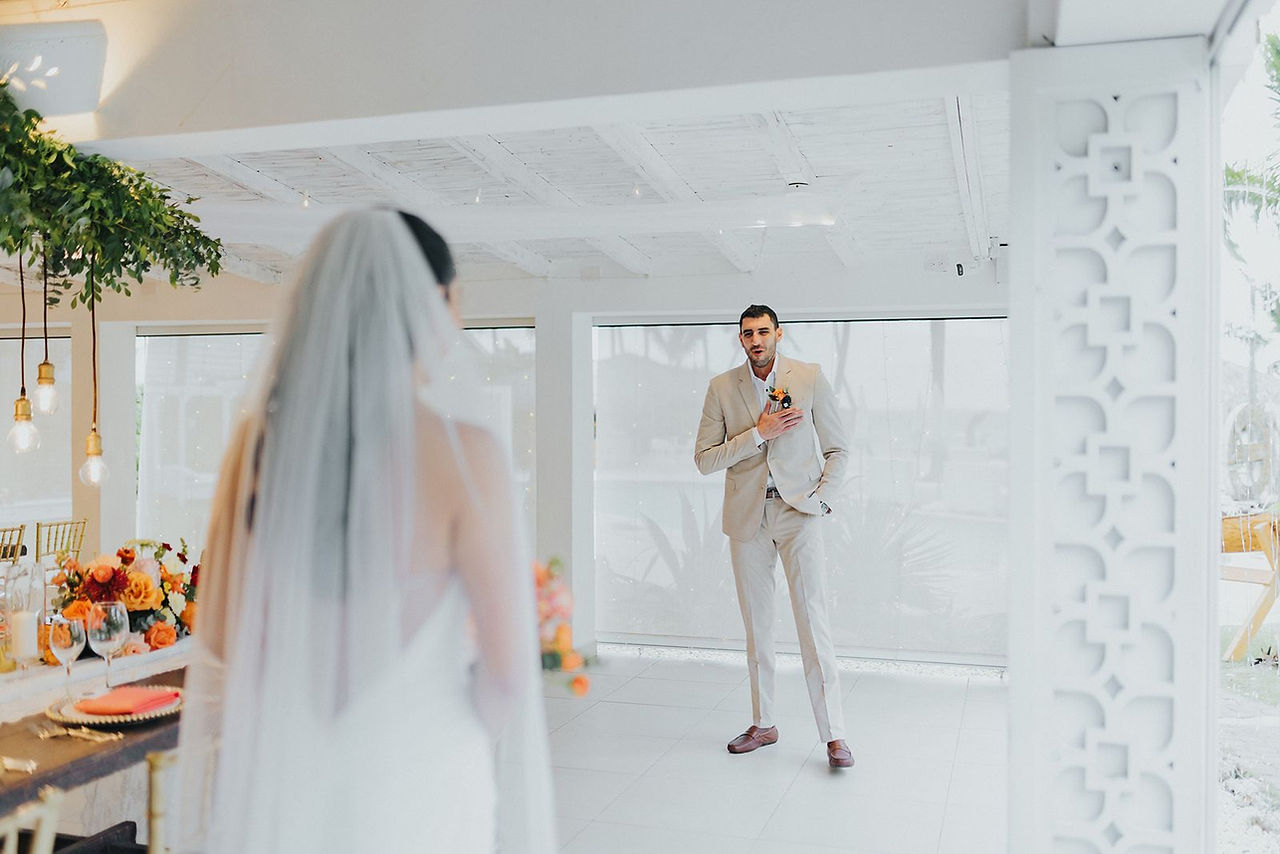 Groom's reaction to first look at bride.