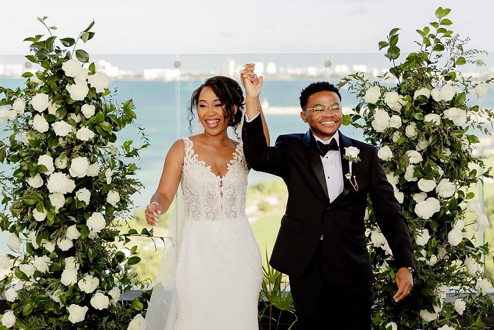 Happy couple celebrating after their ceremony at the Preferred Deck venue at Dreams Vista Cancun.
