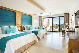 Junior Suite Partial Ocean View room at the all-inclusive Dreams Playa Mujeres wedding resort in Mexico.