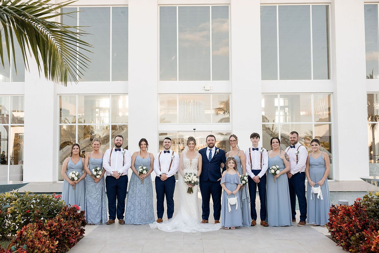 Mexico destination wedding party posing.