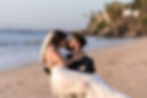 Bride and groom kissing on beach at all-inclusive wedding at Hyatt Ziva Puerto Vallarta resort in Mexico.