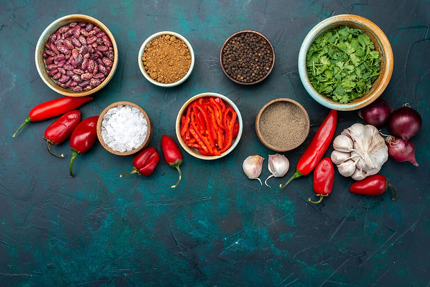 top-view-product-composition-peppers-onions-garlics-greens-with-seasonings-dark-blue-backg