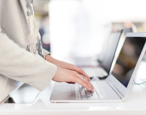 Modern laptop on a clean desk workspace, representing virtual assistant services