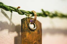 Recordings Rain and Shine(detail2); copper tags, soft rushes copper nails, nettle yarn; 430x240cm; photo A. Thompson; Fiona Percy