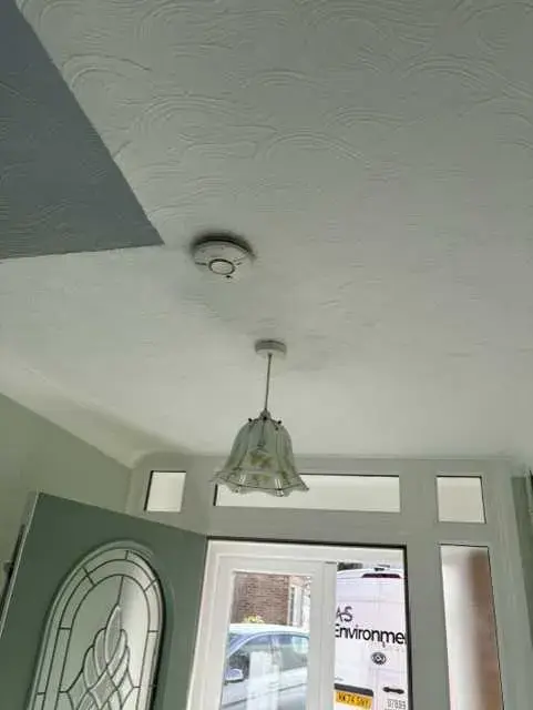 Textured coating to ceiling in residential property