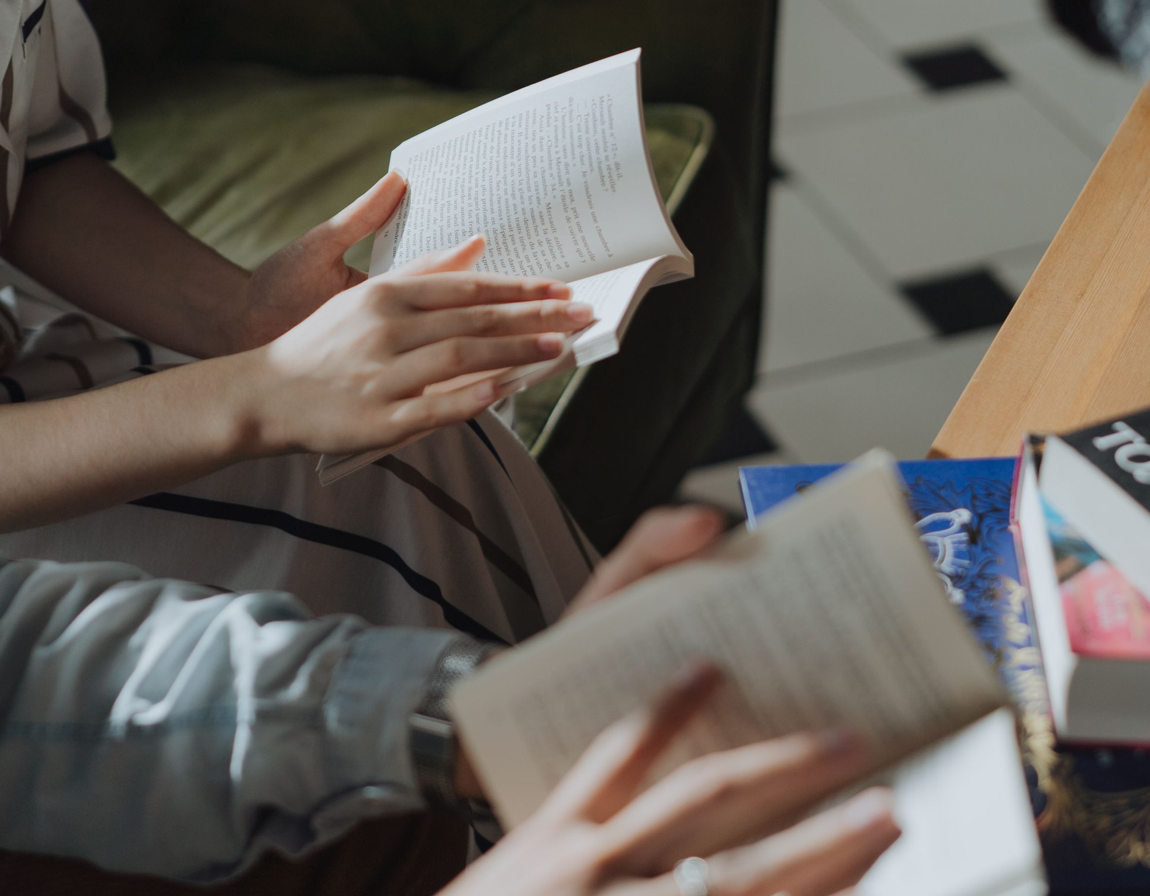 Eye-level view of a child reading a book in a cozy corner