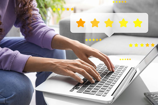 Woman with laptop giving rating to new website at home