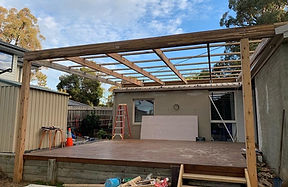 Early stage construction showing site framework and scaffolding.
