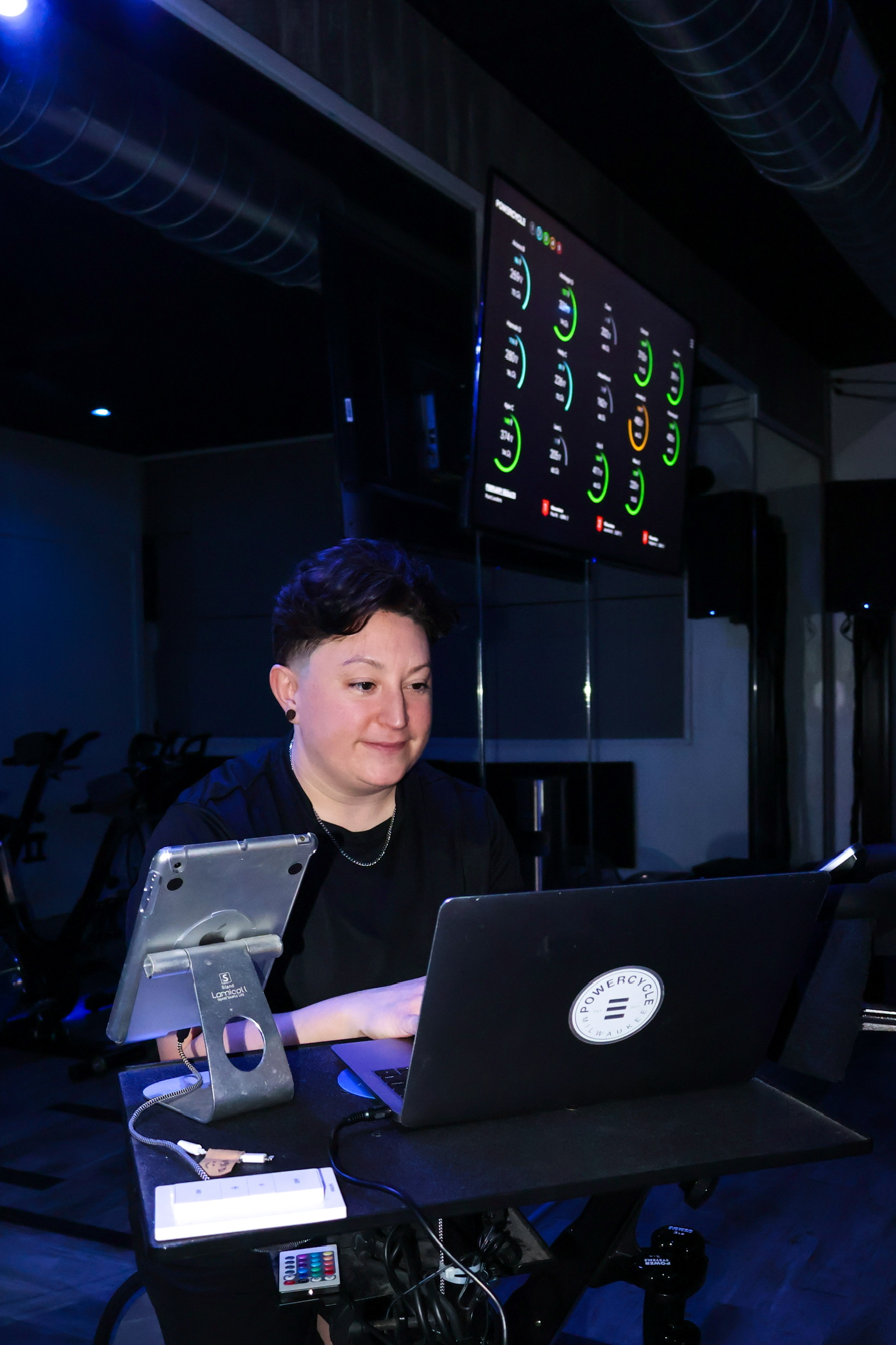 PowerCycle instructor and live ride performance screen in the studio