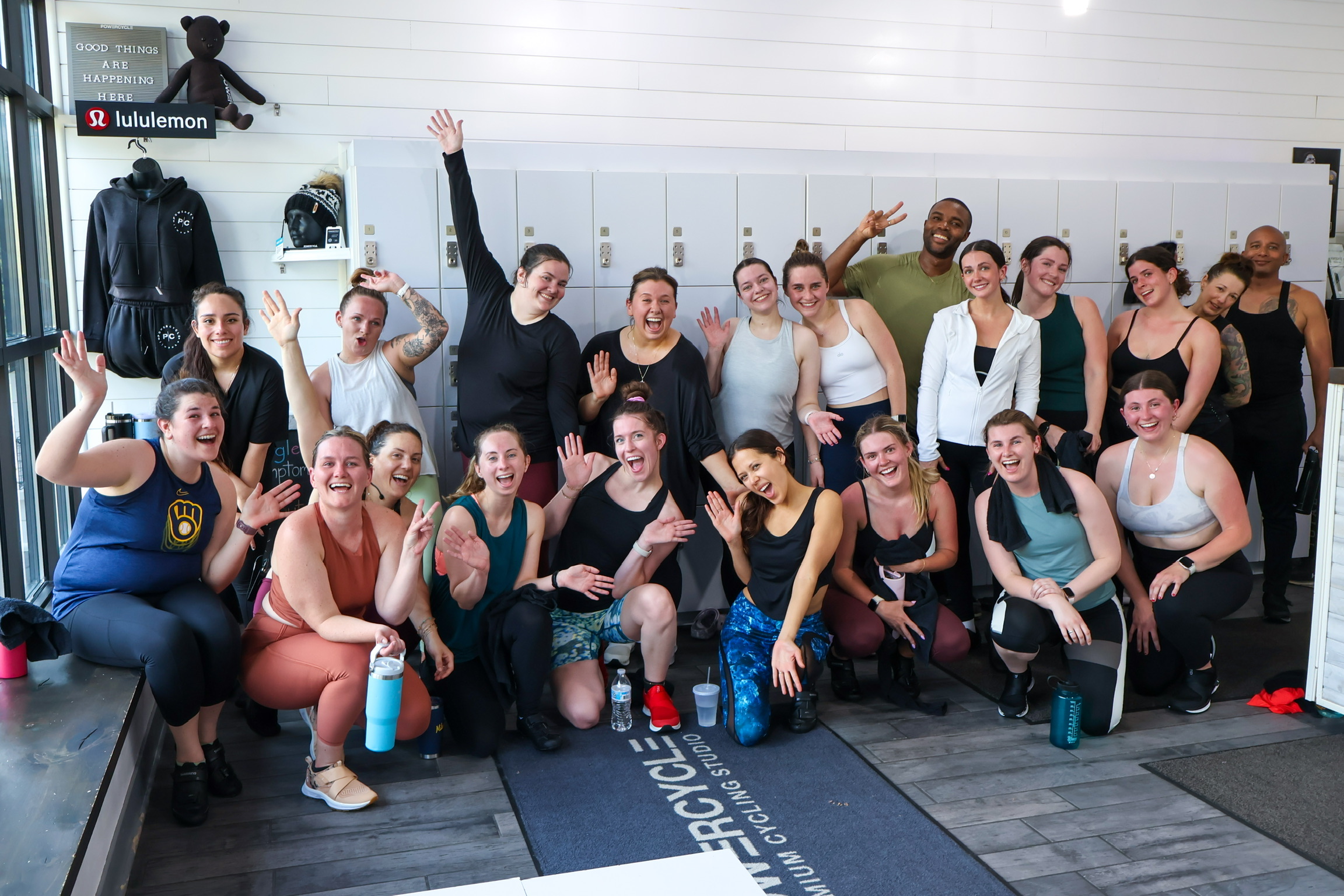 PowerCycle riders celebrating together at the Wauwatosa studio
