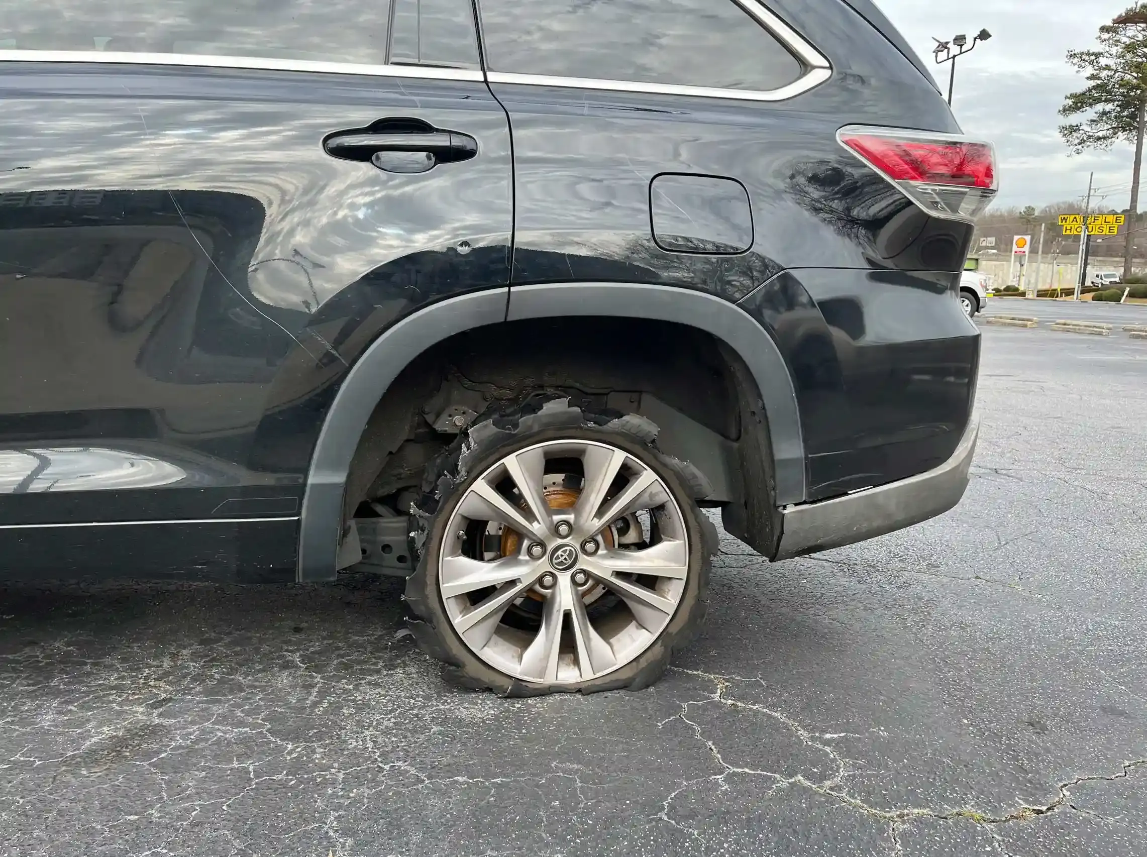 New replacement tire and old torn tire for tire replacement service 