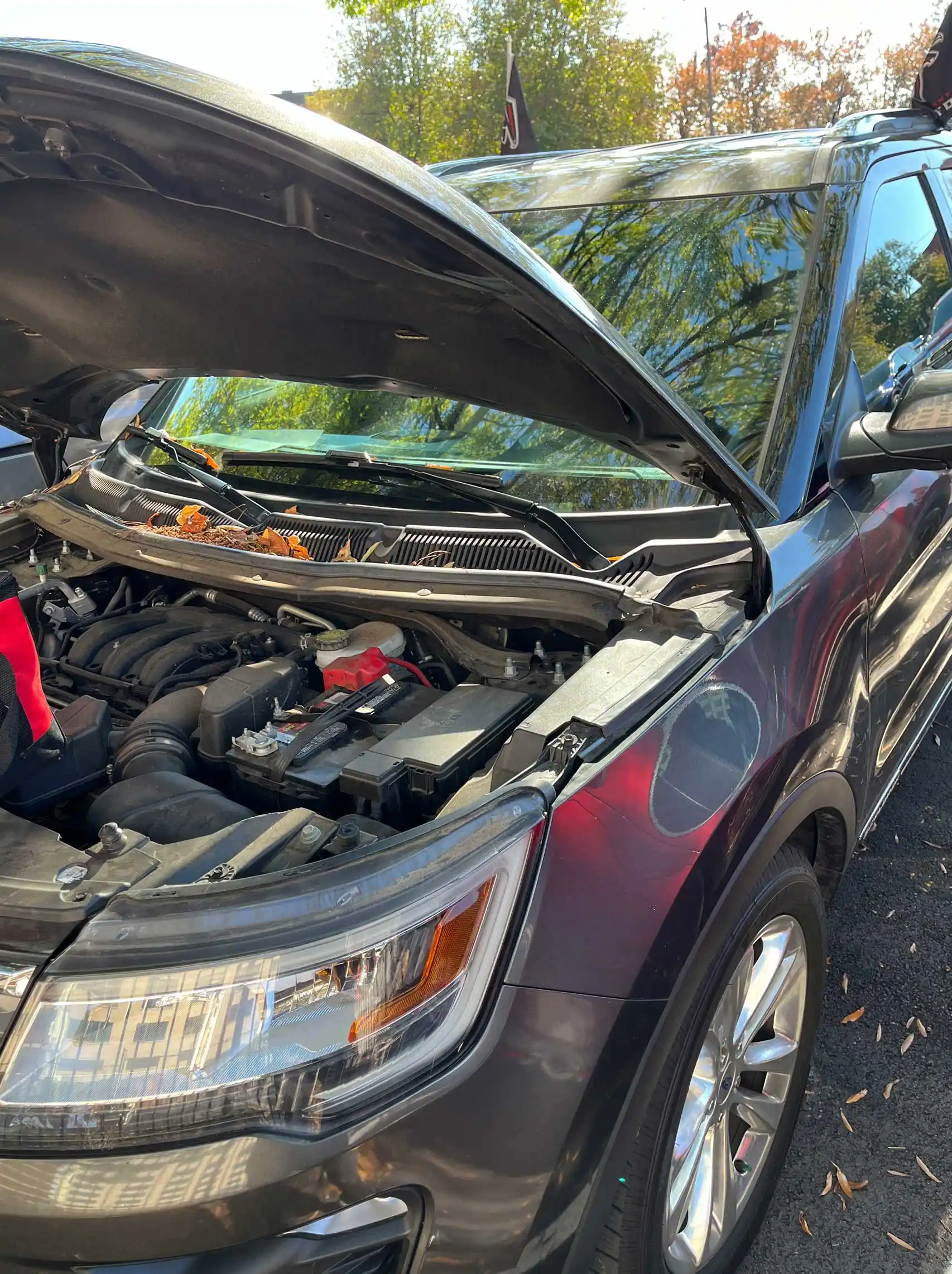 Mobile battery placement on Burgundy Ford Explorer