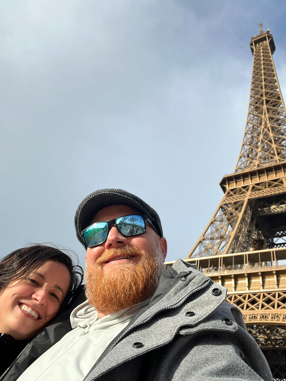 Family holiday photo in Paris after driving trip through Italy and France