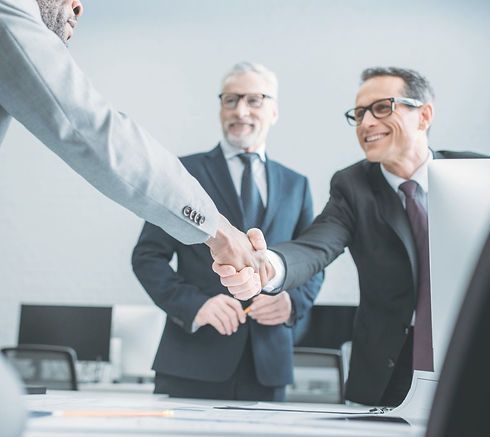 Two Businessmen Shaking Their Hands For Demonstrating The Agreement