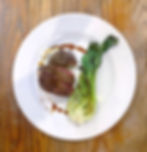Image of a fine dining dish. Depicting steak and Pak Choi